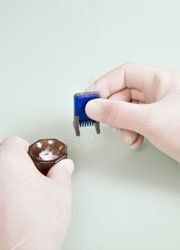 Step 3 of the sample preparation for a melting point analysis