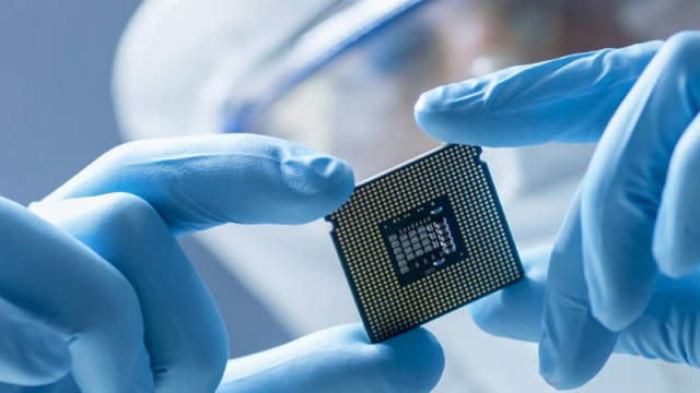 Researcher looking at a semiconductor