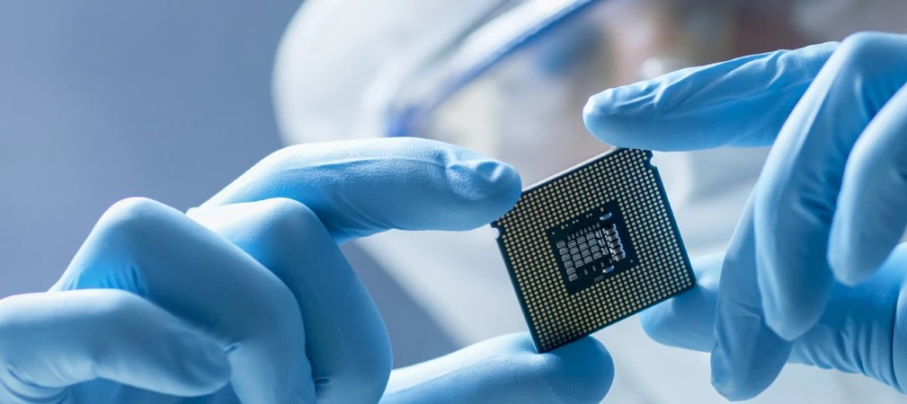 Researcher looking at a semiconductor