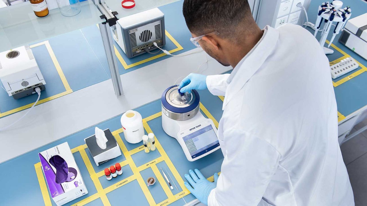 Man working in a pharmaceutical laboratory using lean lab principles