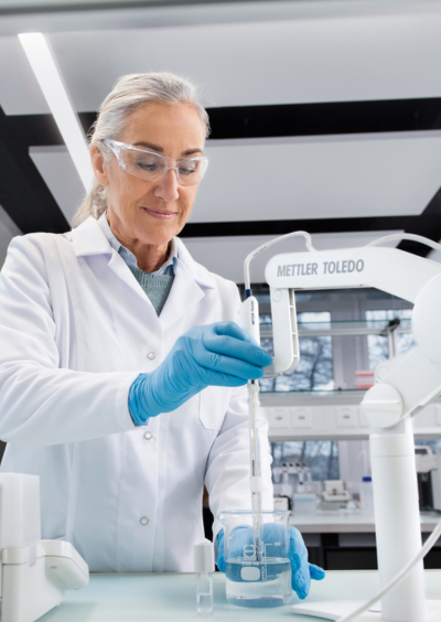 Lab Pharmaceutical Quality Control Guide Scientist measuring pH of a solution