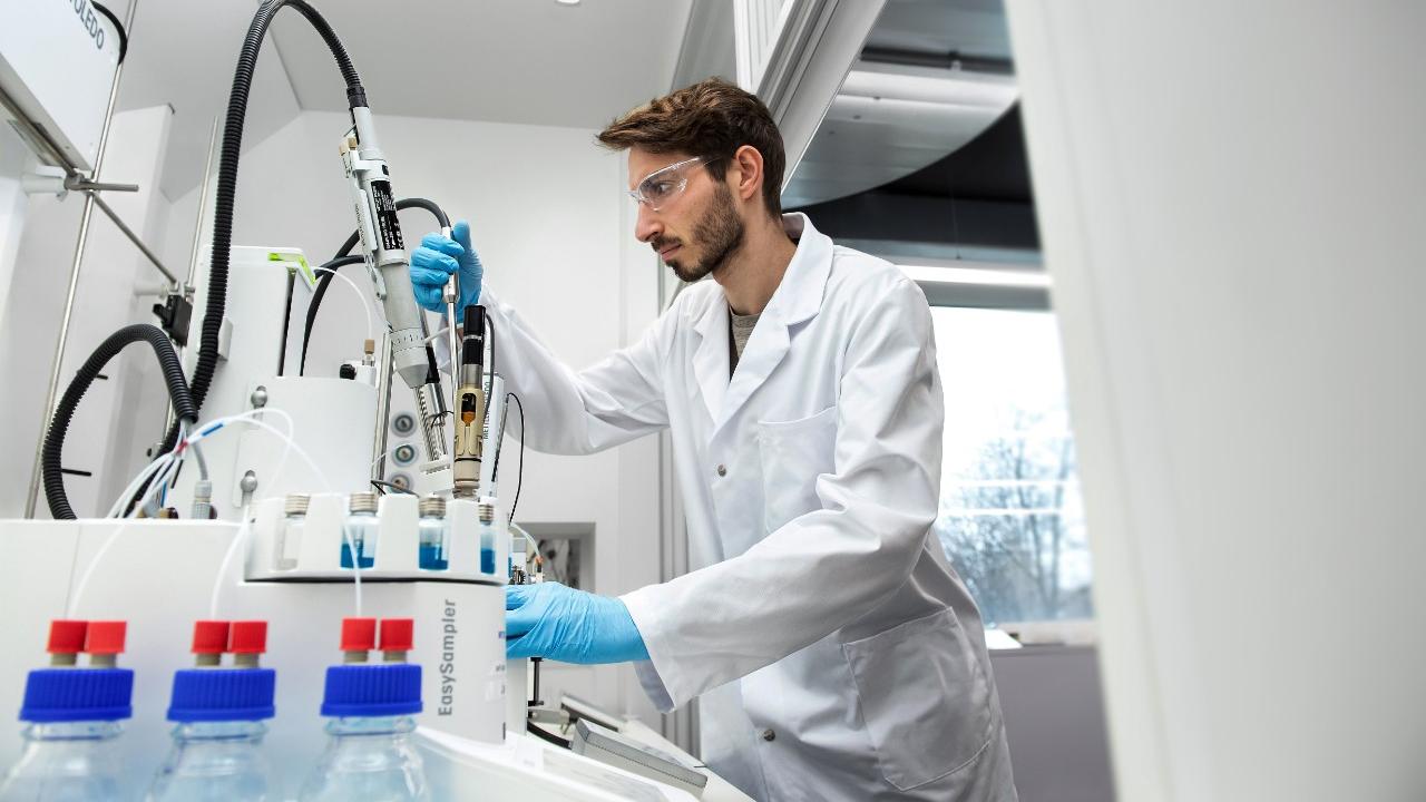 Scientist at a synthesis work station
