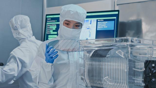Researcher looking at a semiconductor