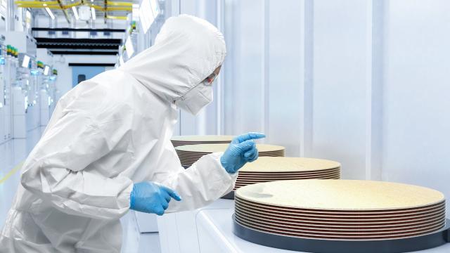 Researcher looking at a wafers