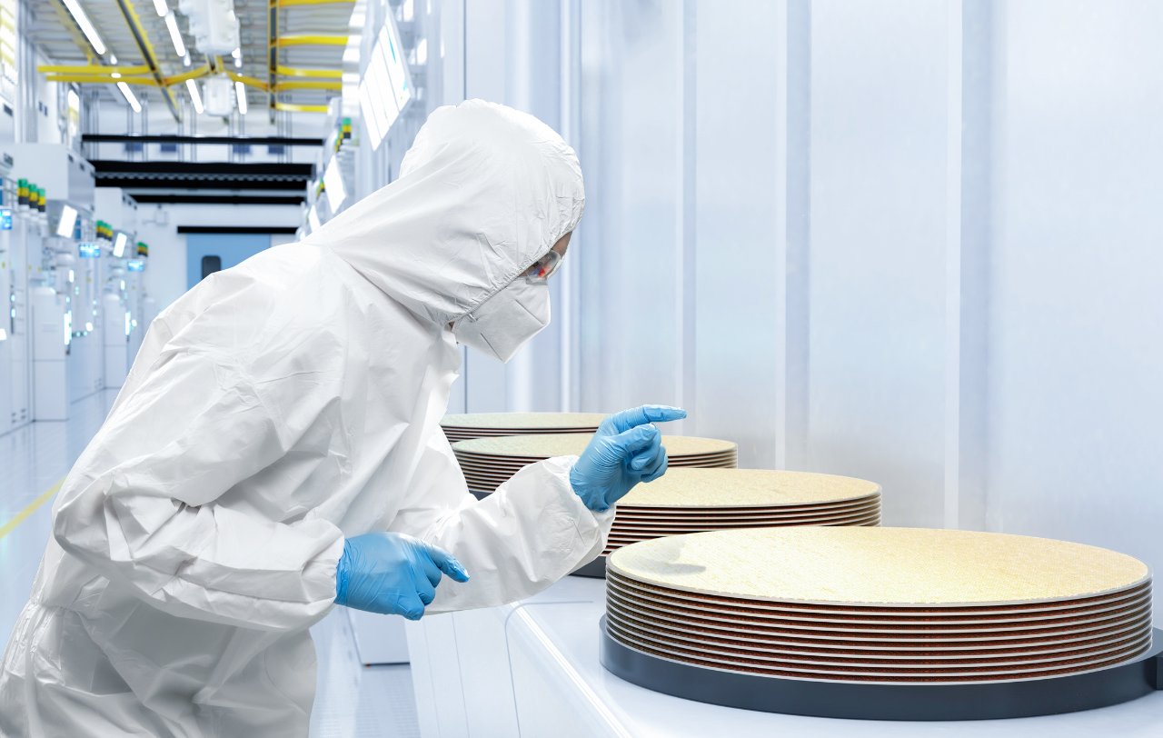Researcher looking at a wafers